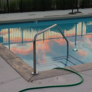 a pool vacuum attaches to the pump through the skimmer inlet or a dedicated vacuum port in the pool wall